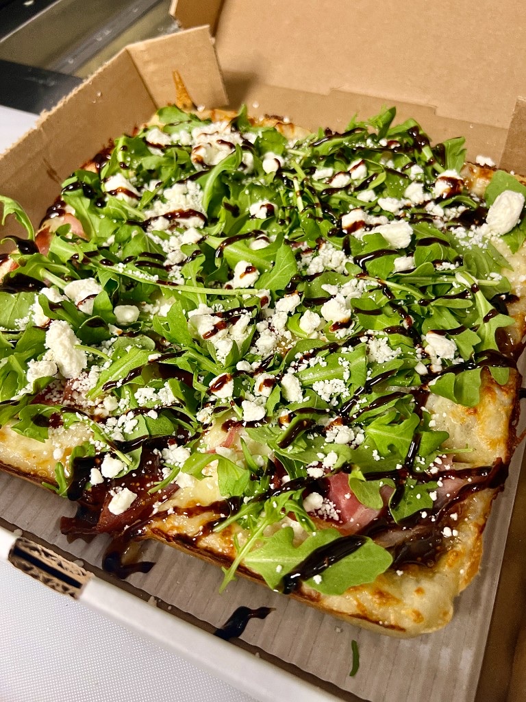 Detroit-style pan in an Uncle G's box, ready for pickup